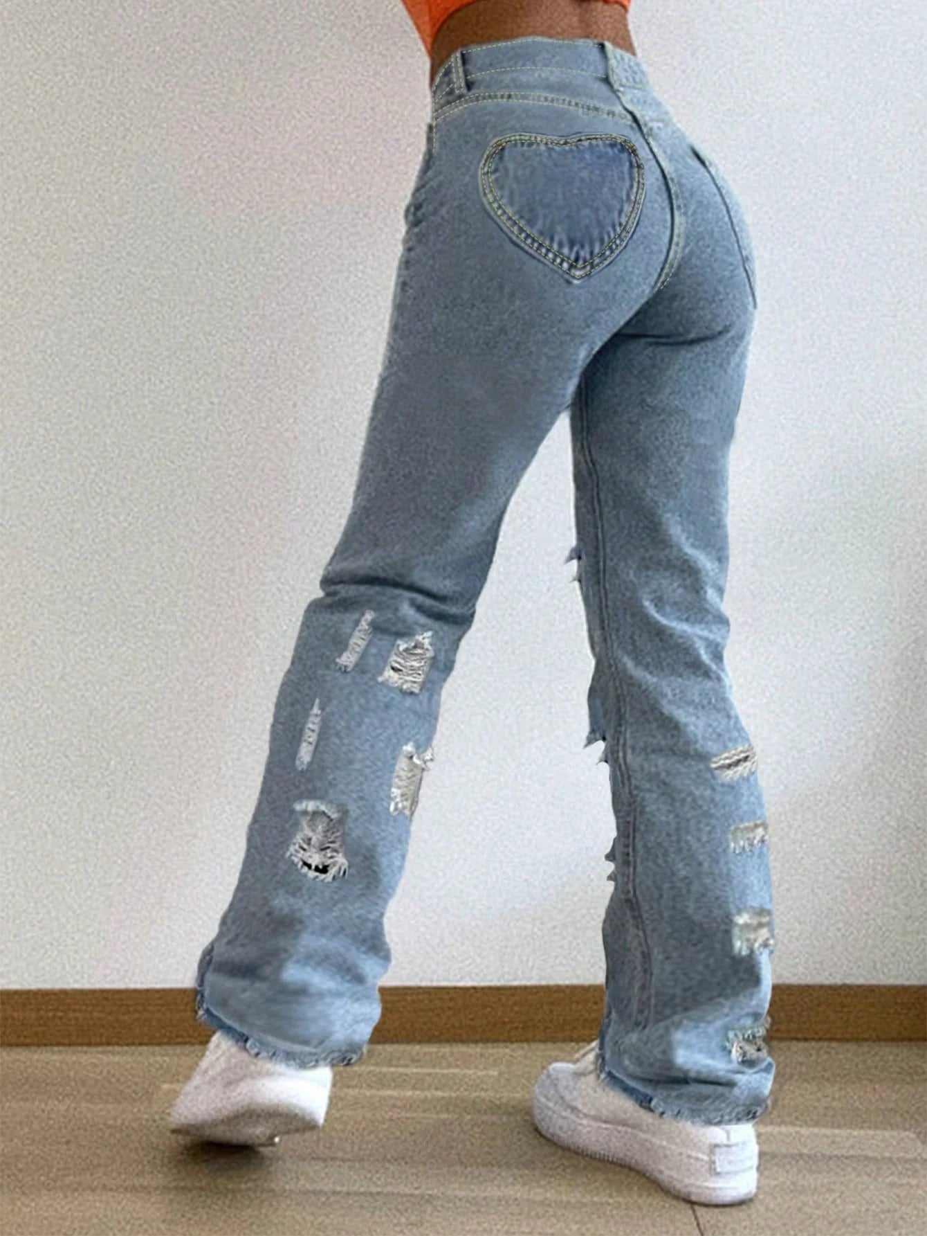 Street trend women's heart back pocket ripped slim-fit jeans